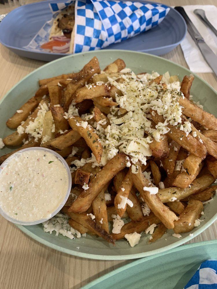 Fries topped with feta, with a spicy feta dip